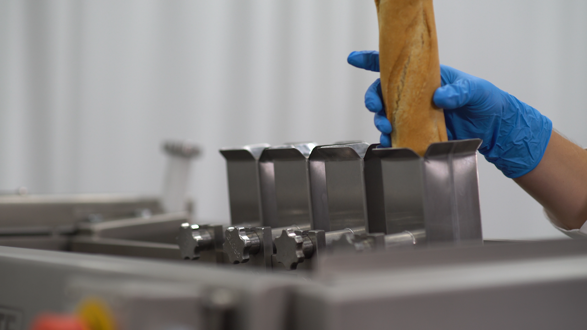 Loading a baguette into a Grote Bread Slicer